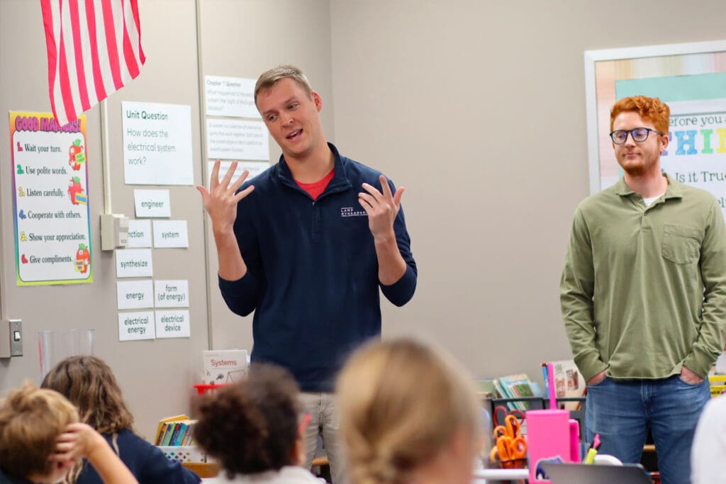 Lamp Rynearson engineers Drew Stirek and Joel Smith at a Legacy LAB classroom presentation