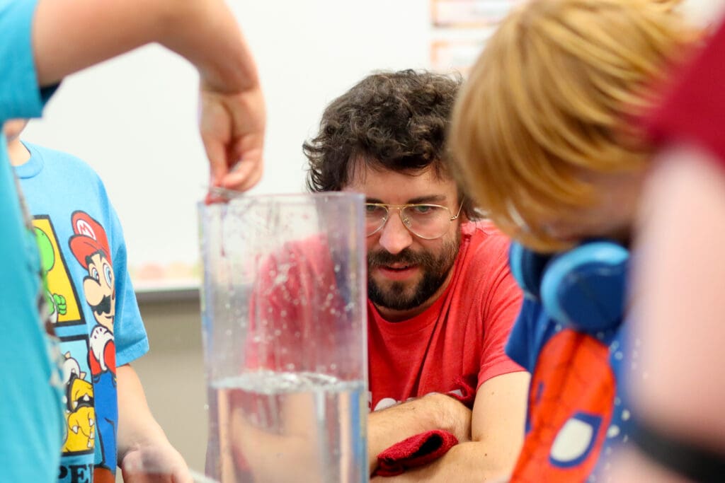 Legacy LAB founding member Rob Vanderveen helping students problem solve an engineering exercise